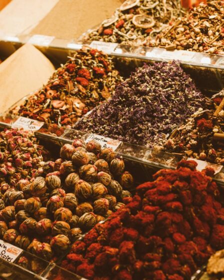 containers full of spices on a market stall