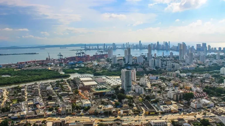 . Aerial view of Colombia City's skyline, showcasing modern skyscrapers against a clear blue sky.
