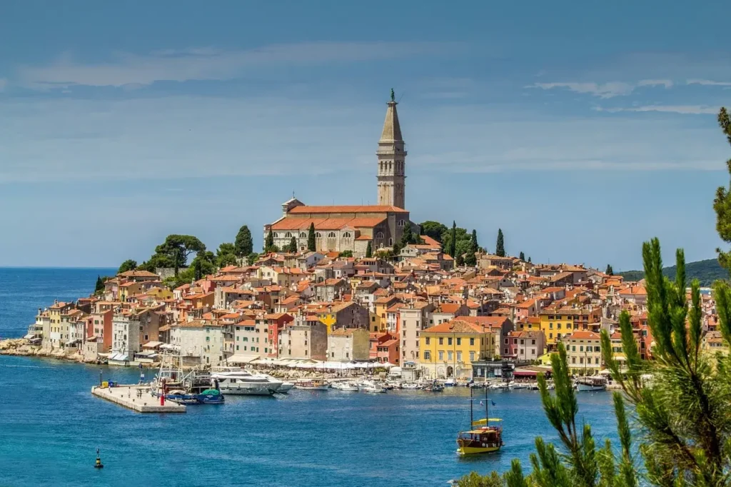 A scenic view of Rovinj, a charming coastal city on Hvar Island, Croatia, featuring colorful buildings and a vibrant harbor.