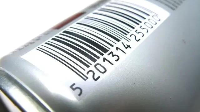 A can of soda featuring a visible bar code on its label
