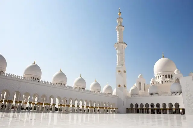 Sheikh Zayed Grand Mosque in Abu Dhabi, showcasing its stunning white domes and intricate architectural details