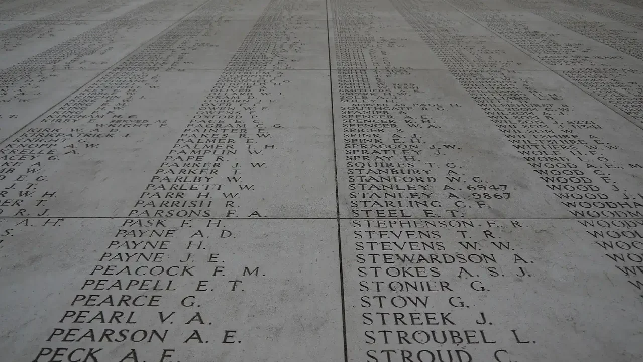 A memorial wall displaying the names of men who lost their lives in the war, honoring their sacrifice and memory