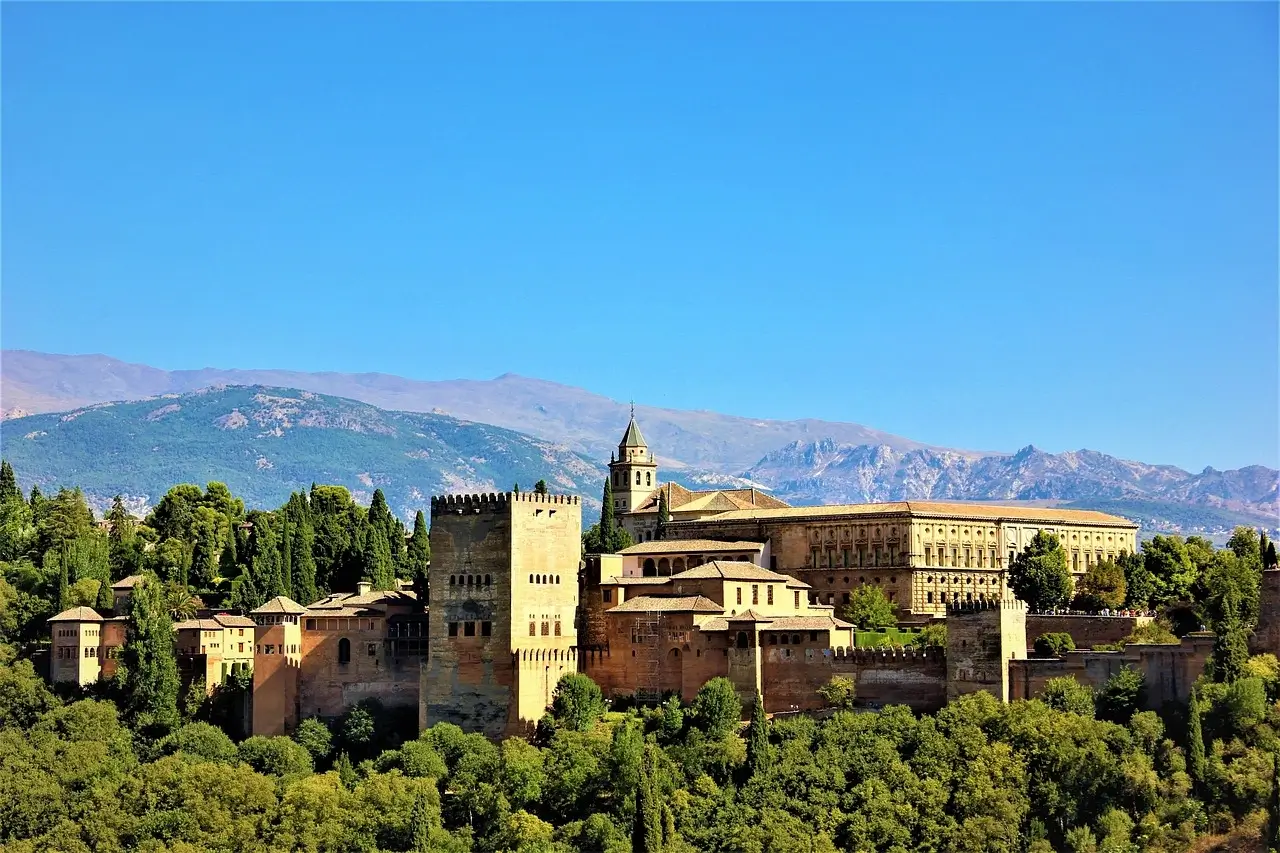 The Alhambra Palace in Granada, Spain, showcasing intricate Islamic architecture and lush gardens