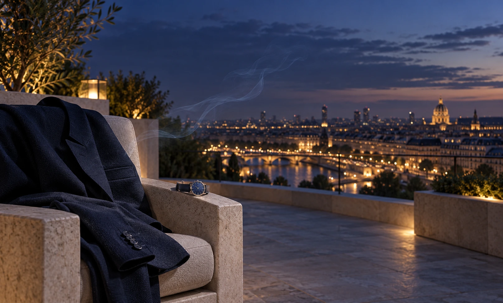 A navy jacket and wristwatch on a rooftop at blue hour, with a fading scent-like mist representing the time before reapplying Bleu de Chanel.